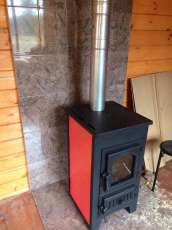 Купить стальной камин Везувий ПК-01 (270) в Орше фото в интерьере в Орше