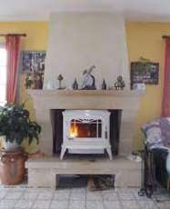 Печь-камин чугунный Invicta Bradford в интерьере Амазонка бай фото в Орше