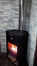 Стальной недорогой камин Теплодар ОВ-120 (угловой) фото в интерьере в Орше