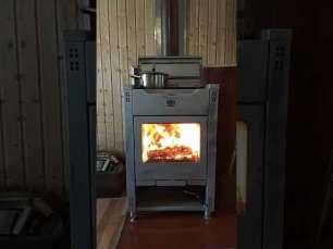 Стальной камин со стеклом Теплодар Кадриль фото в интерьере в Орше