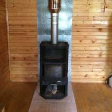 Печь-камин с шамотом Мета-Бел Ангара-Аква в интерьере фото в Орше