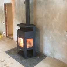 Купить недорогой камин с шамотом Мета-Бел Енисей в Орше фото в интерьере в Орше