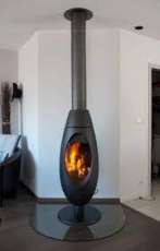 Печь-камин чугунный Invicta Ove в интерьере Амазонка бай фото в Орше