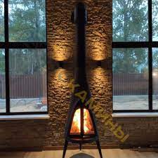 Печь-камин чугунный Invicta Pow-Wow в интерьере Амазонка бай фото в Орше